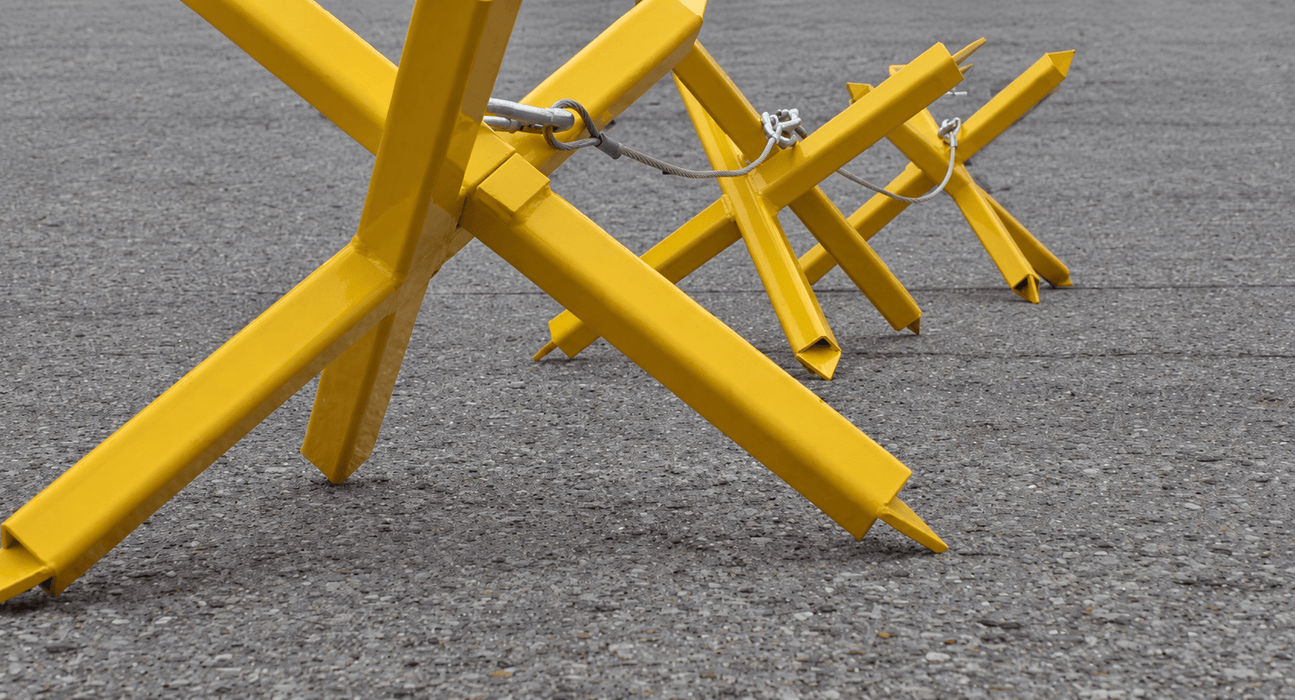 Portable Anti-Ram Vehicle Spike Barrier System for Security Checkpoints & Temporary Roadblocks | Global GRAB STAR Barriers