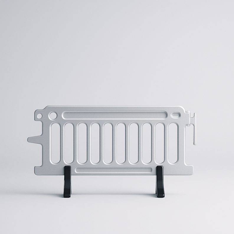 Metallic object with a grid design on a light gray background