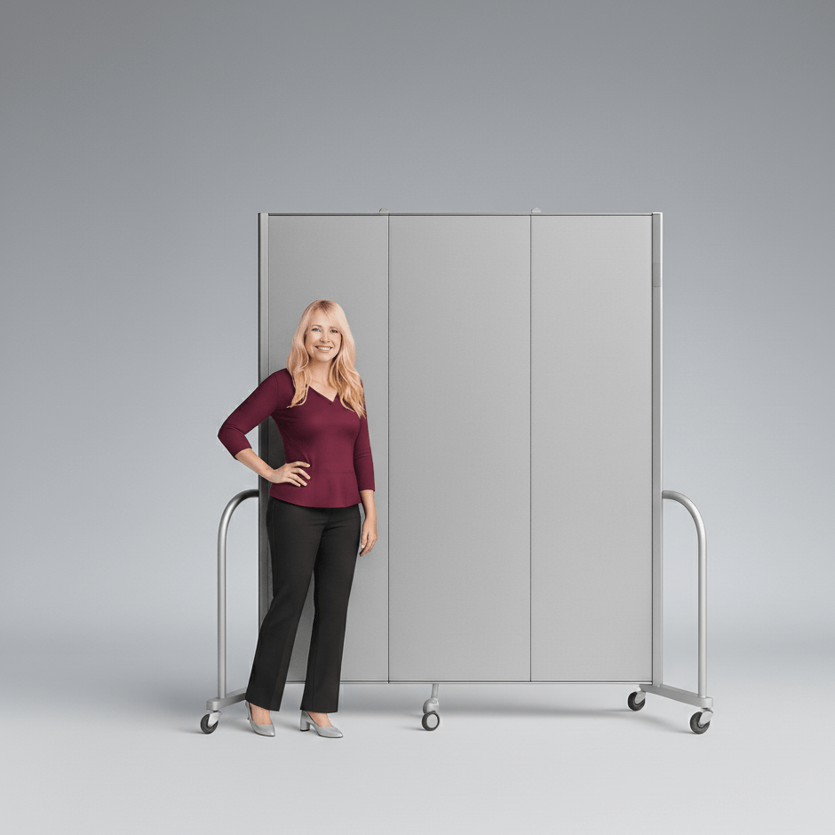 Woman standing next to a portable partition screen called screenflex.